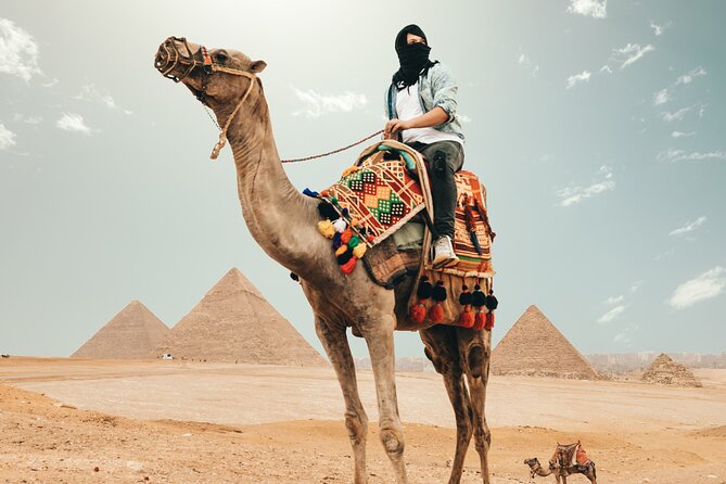 Day Tour To Giza Pyramids With Camel Ride And Egyptian Museum In Cairo - Giza Plateau views: the pyramids of Cheops, Chephren, and Mykerinus