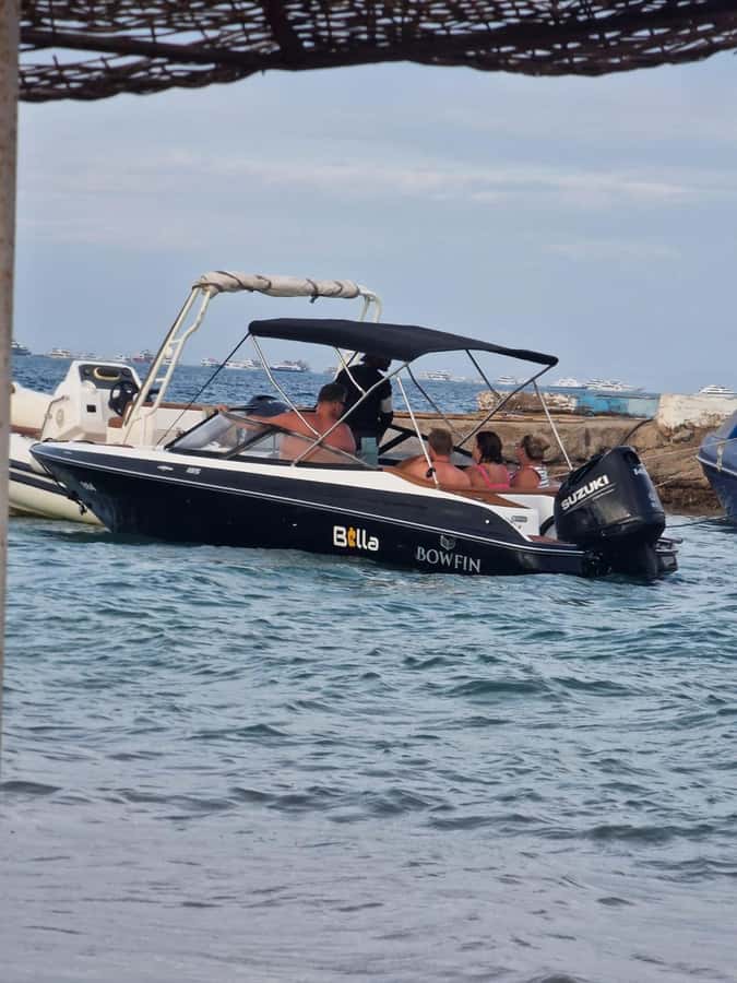 Hurghada: Private Speedboat to Magawish Island - Snorkeling in calm, clear water with provided gear