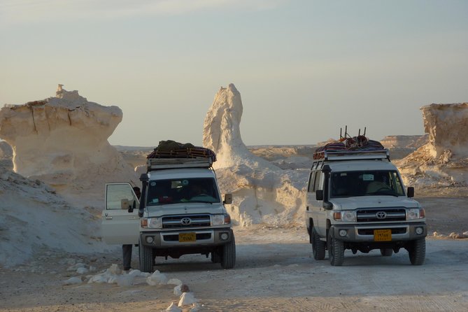 Overnight White Desert Safari Camping from Cairo - Bahariya Oasis and Bawiti: palms, dunes, and English Mountain views